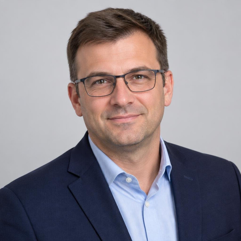 Studio portrait of a Croatian man systems analyst with glasses